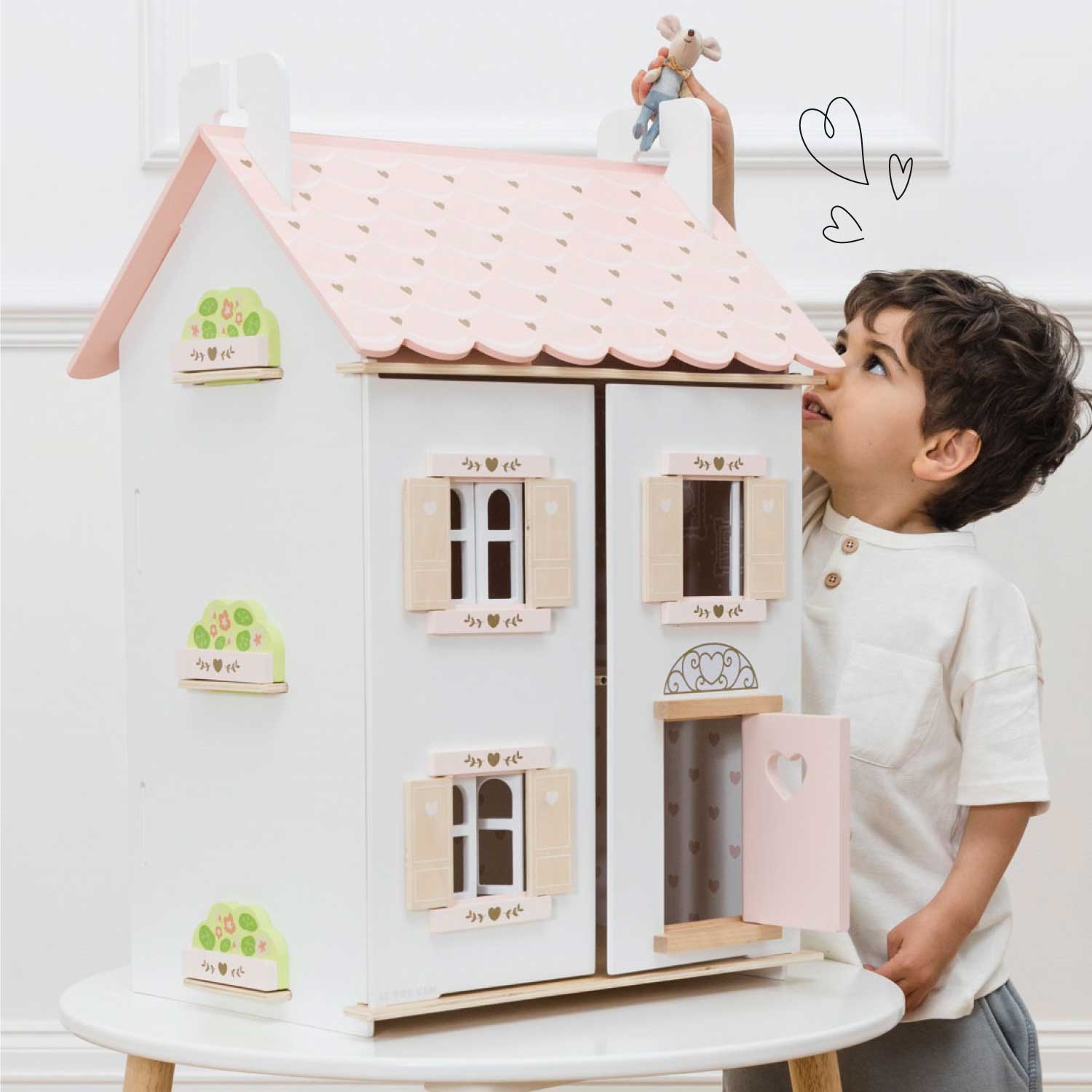 Pink and white dolls house online